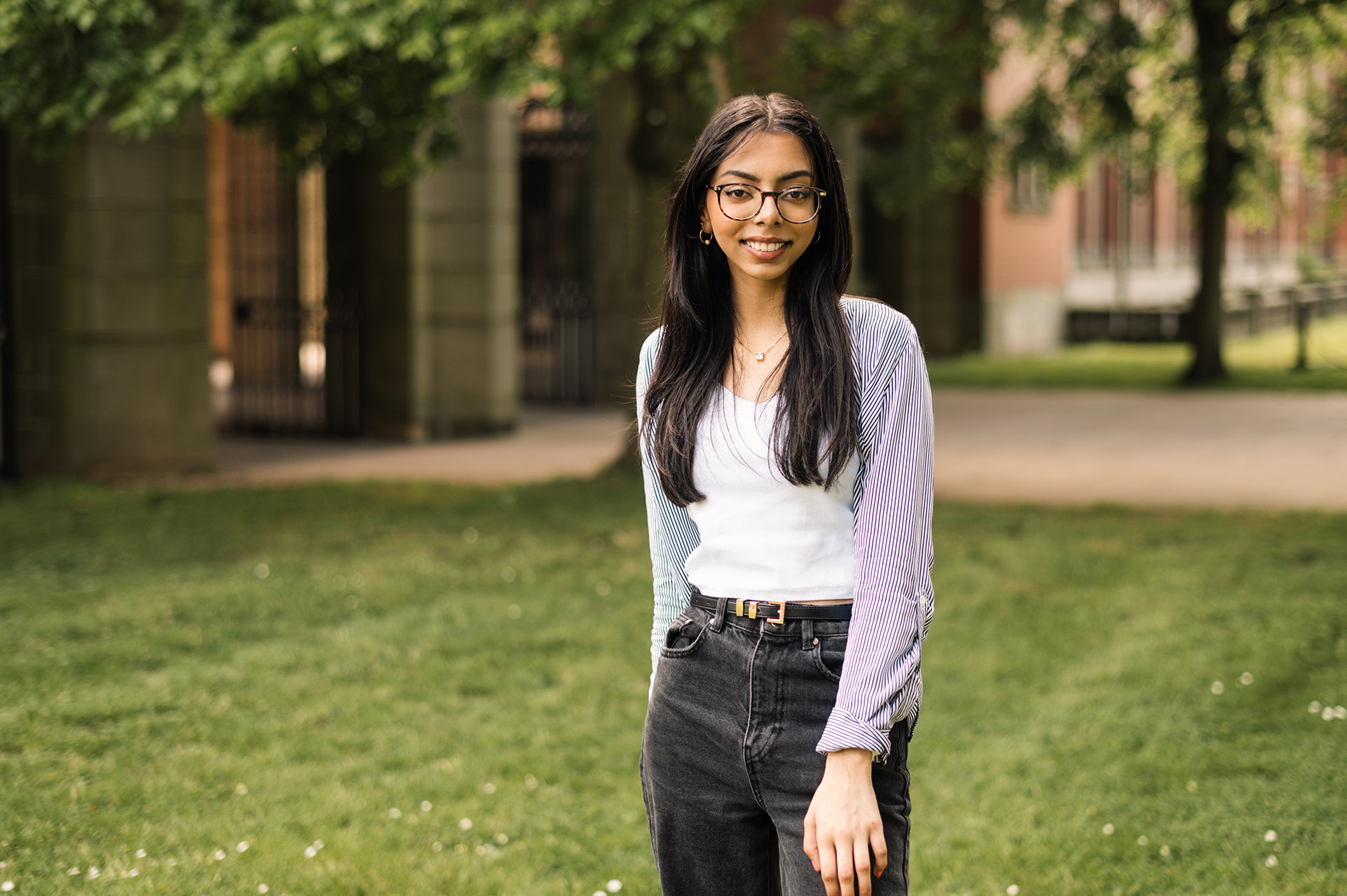 Reema, who studies Law with French law, standing in the University of Birmingham's green campus