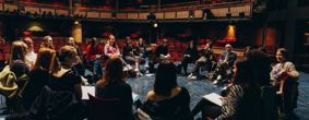 Students and staff in the Royal Shakespeare Theatre, Stratford-upon-Avon