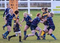 women playing rugby
