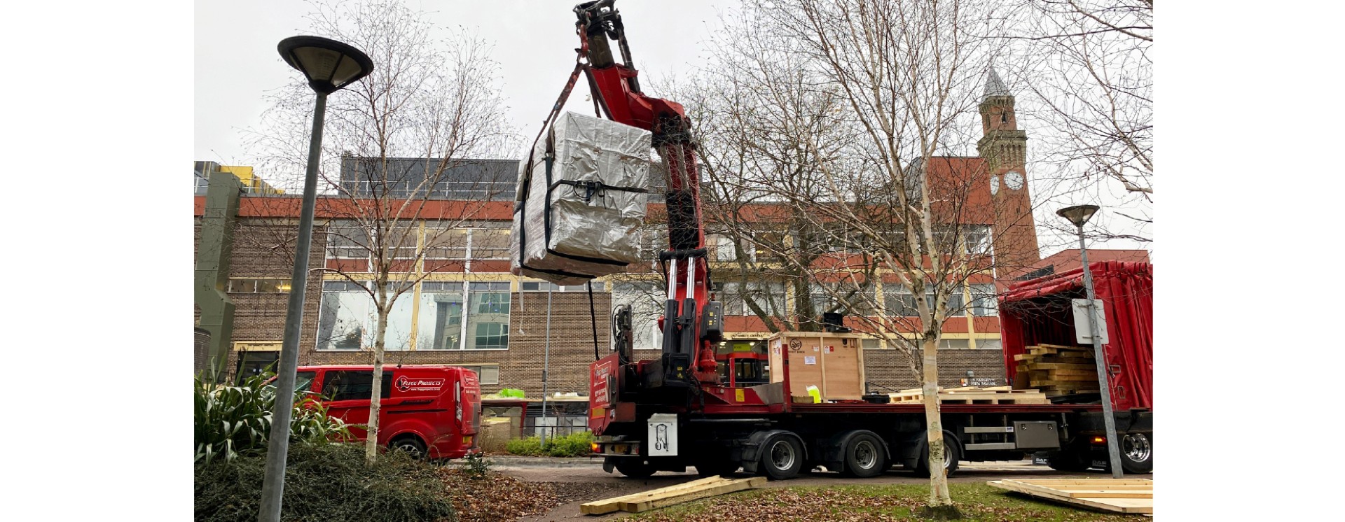 Large machine delivered by a mini crane.