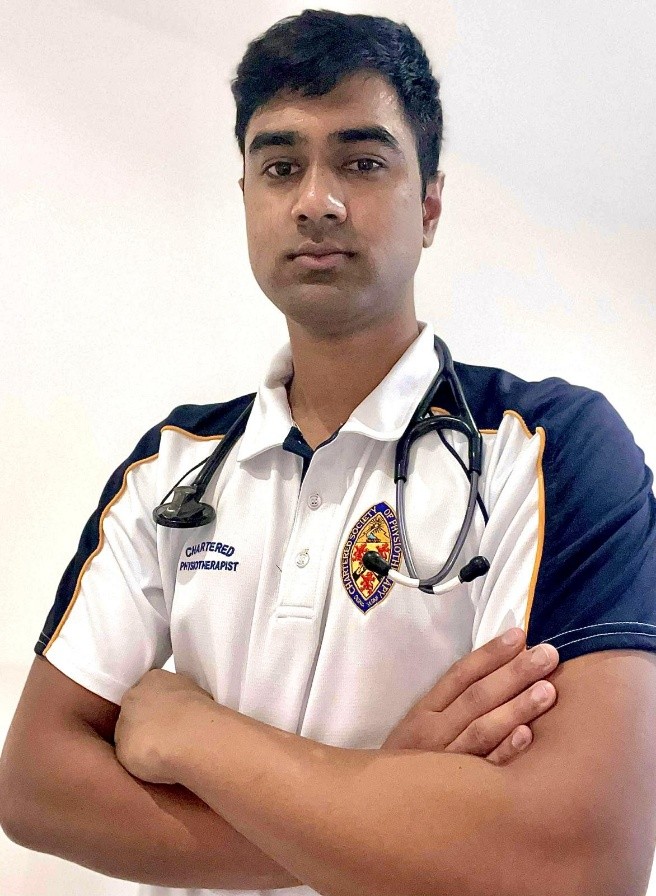 Student Profile picture, man in physio uninform looking at camera