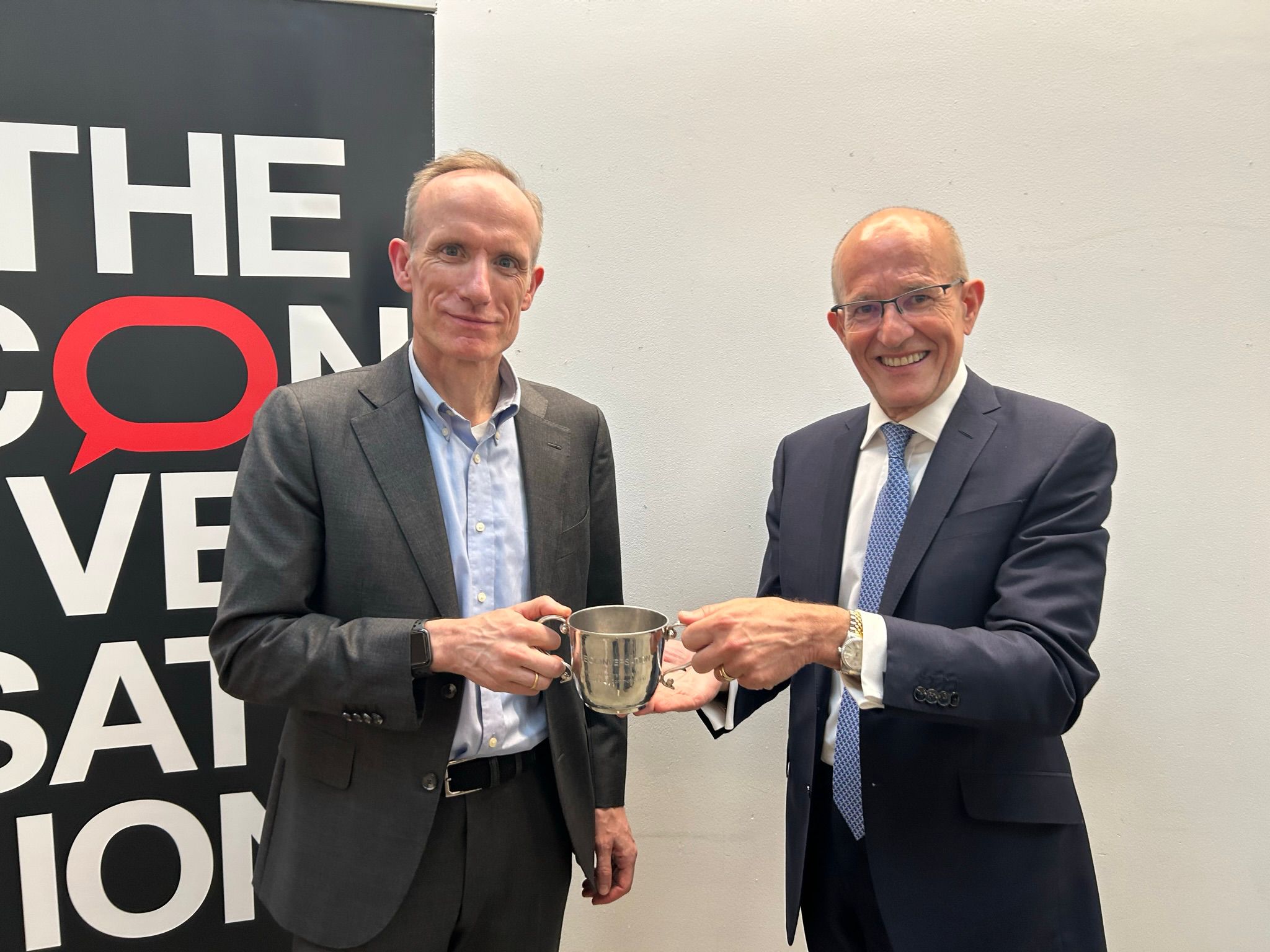 Professor Stefan Wolff receiving the Sir Paul Curran Award from Sir Paul Curran.