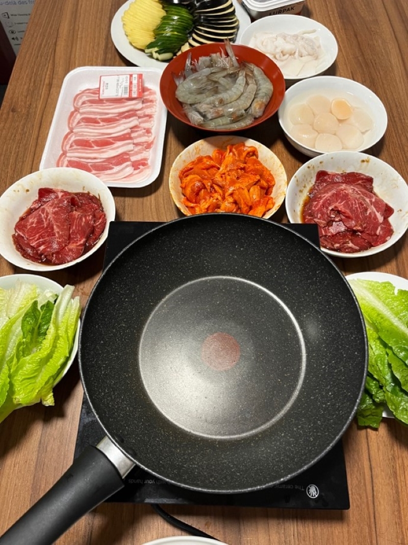 Student meal prep including a range of ingredients and cooking utensils 