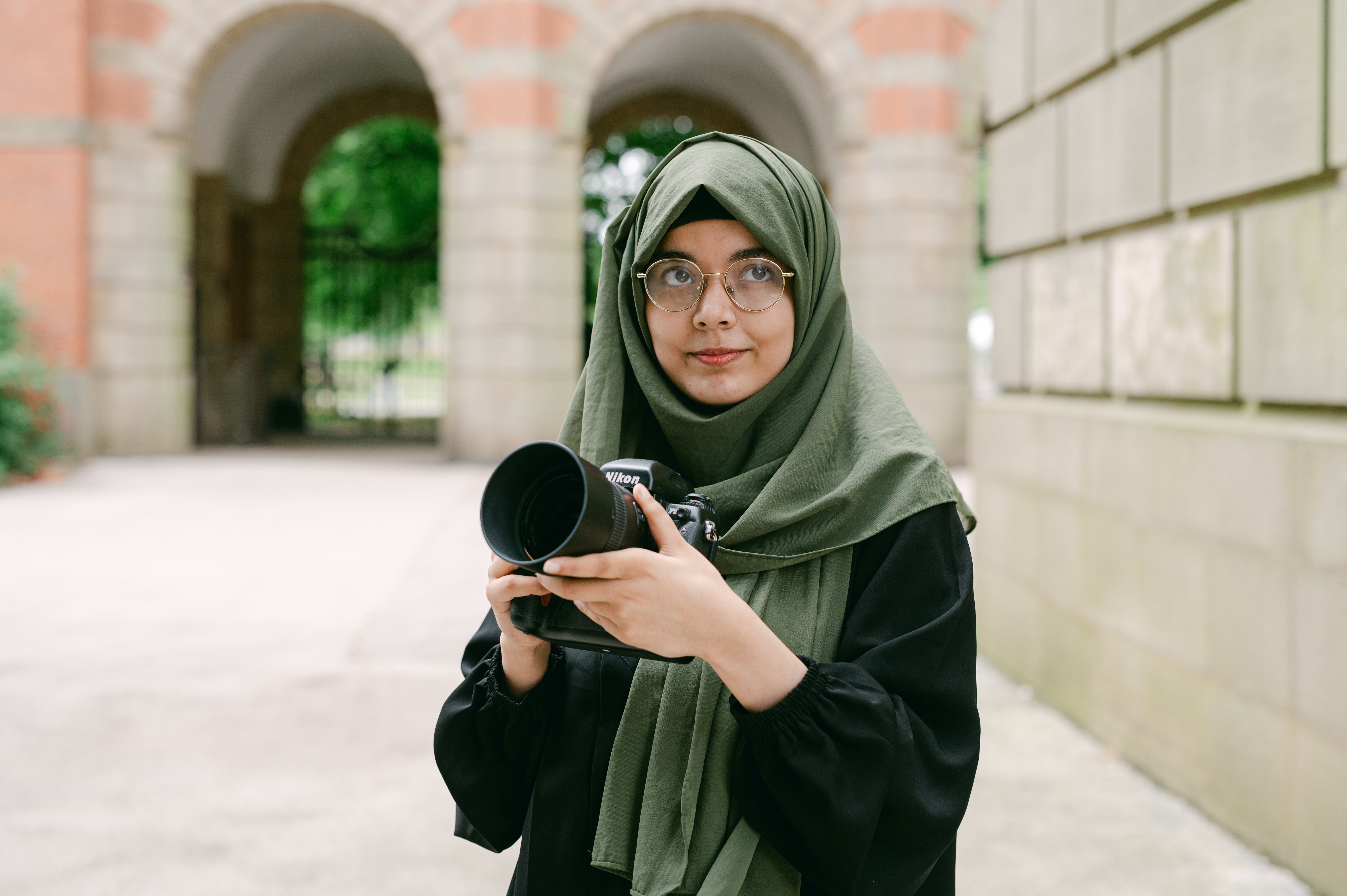 Student holding a camera