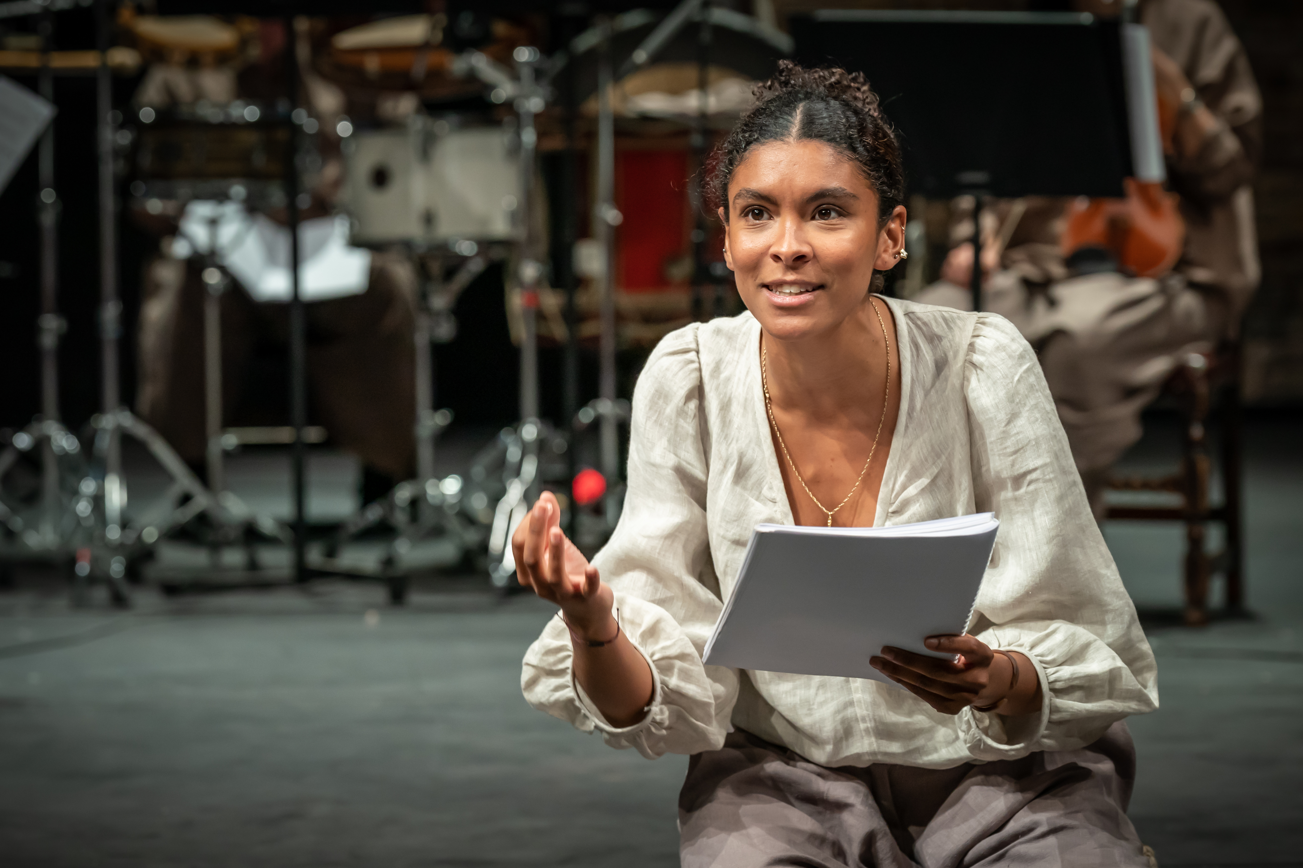 Thalissa Teixeira rehearsing for Dido Queen of Carthage with a script in her hand