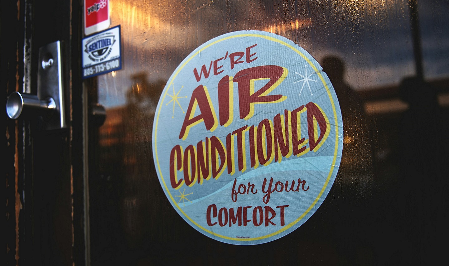 Air conditioning sign in window of cafe