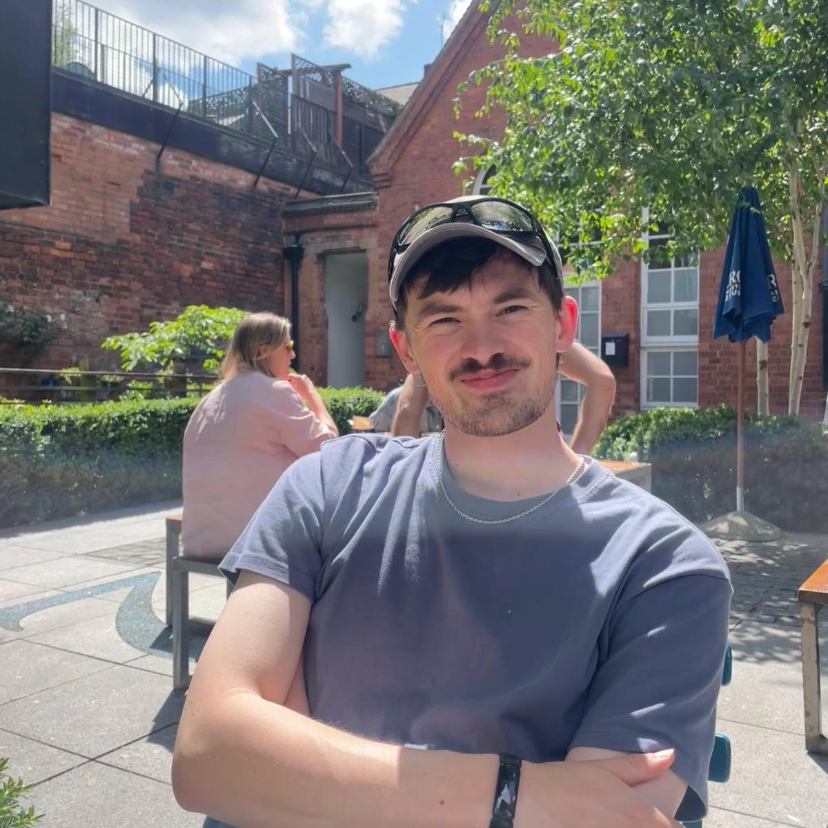 Student Will in a sunny garden