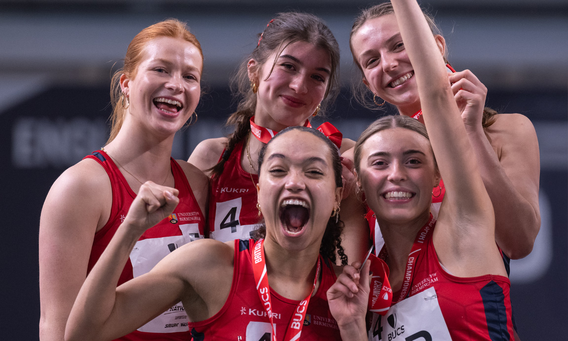 Female University of Birmingham athletes strike a celebratory pose 