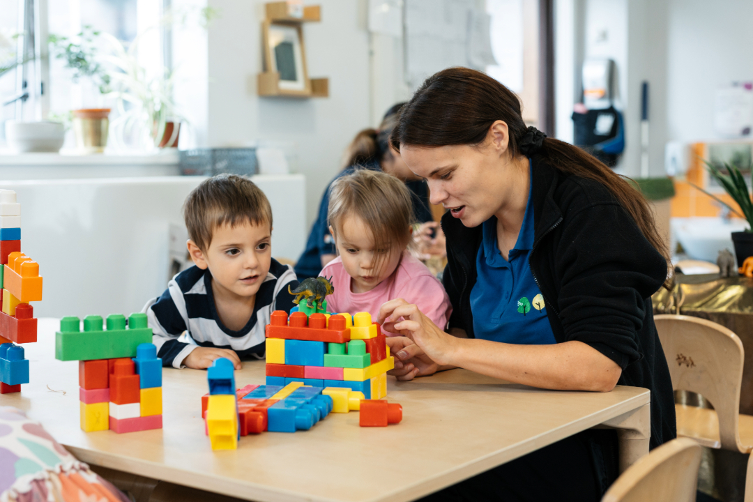 Young children playing with building blocks