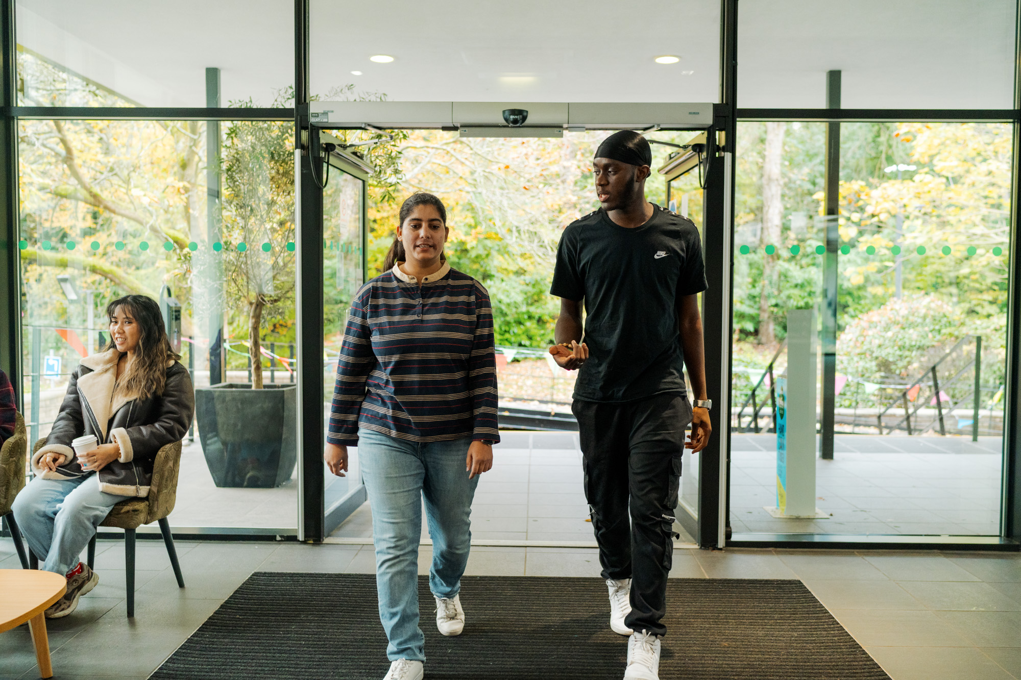 Two students walking through Shackleton reception