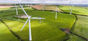 wind turbines in green fields