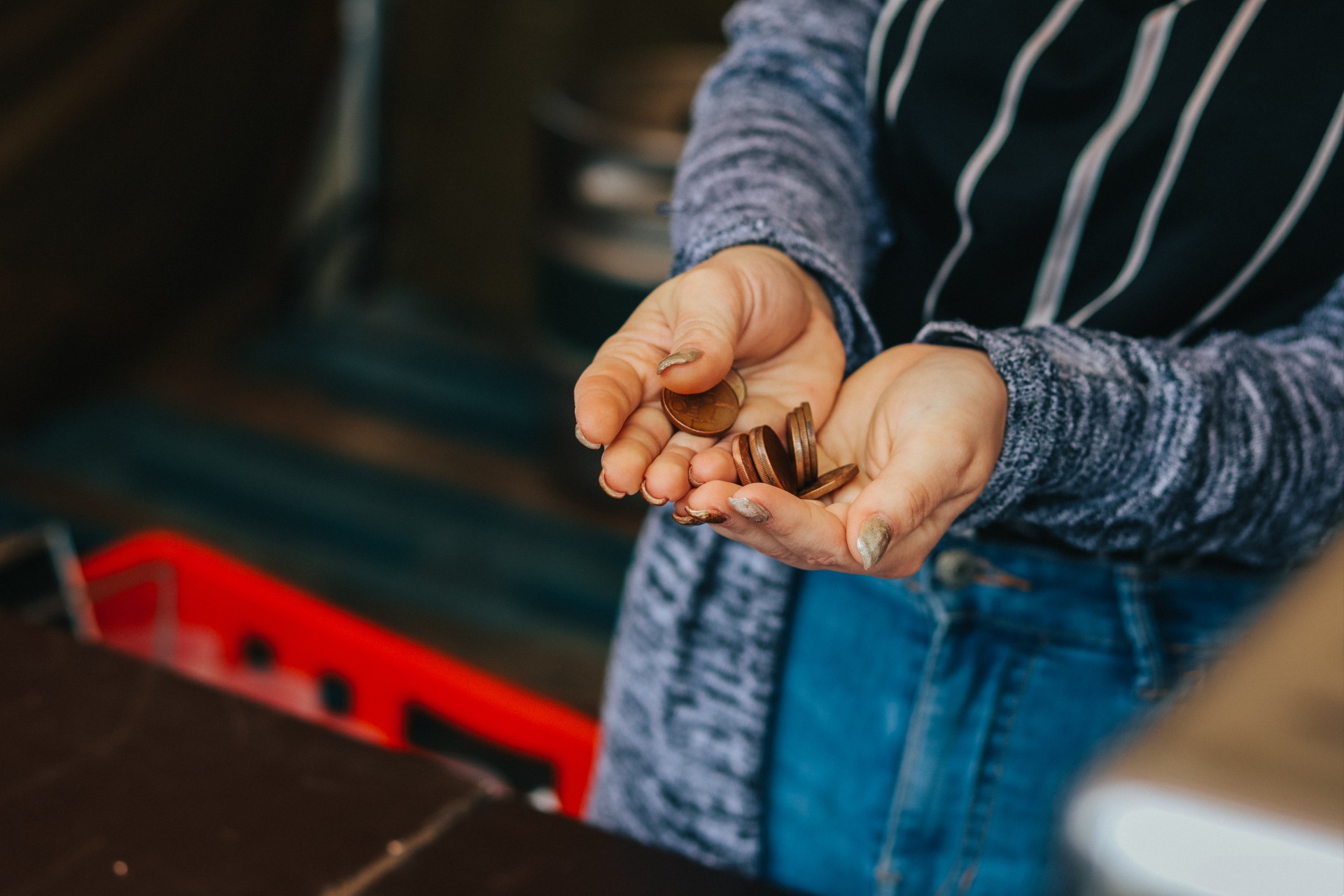 Woman holding some coins in her hands