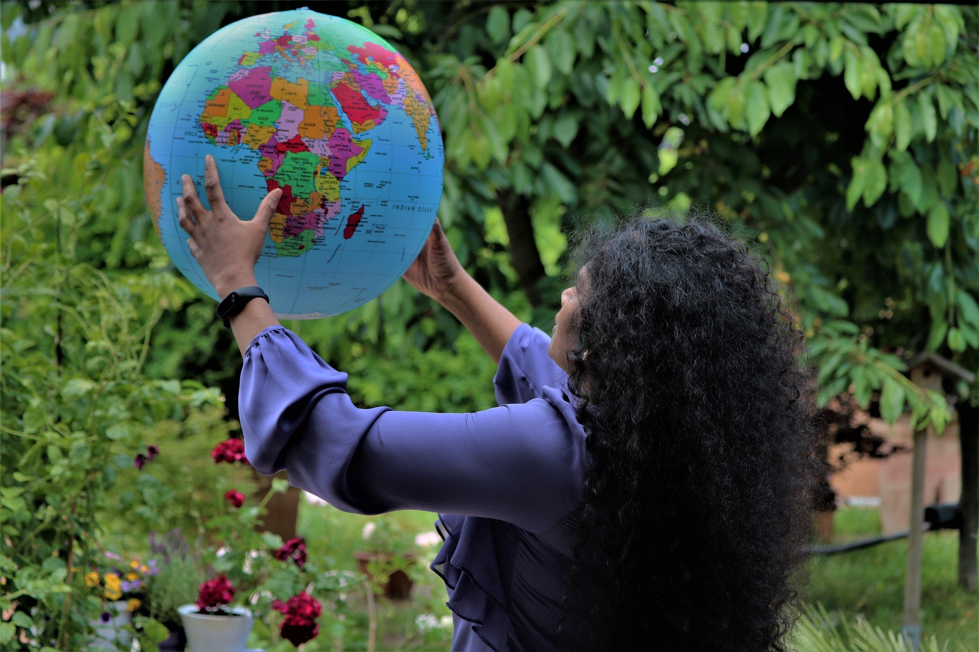 Woman holding a globe