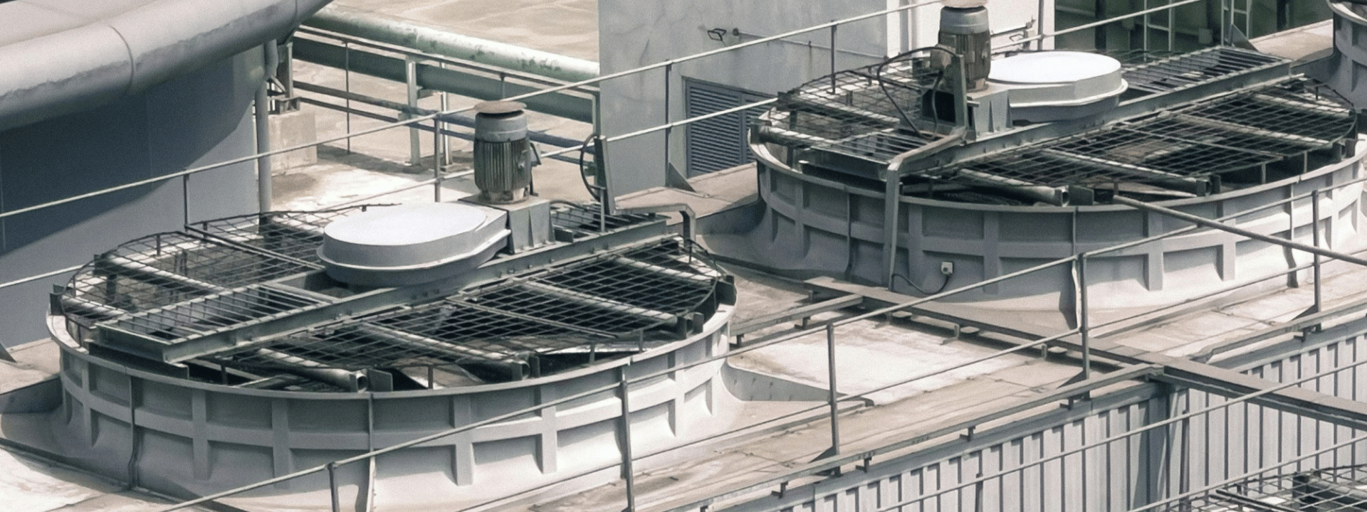 Cooling towers on an industrial rooftop.