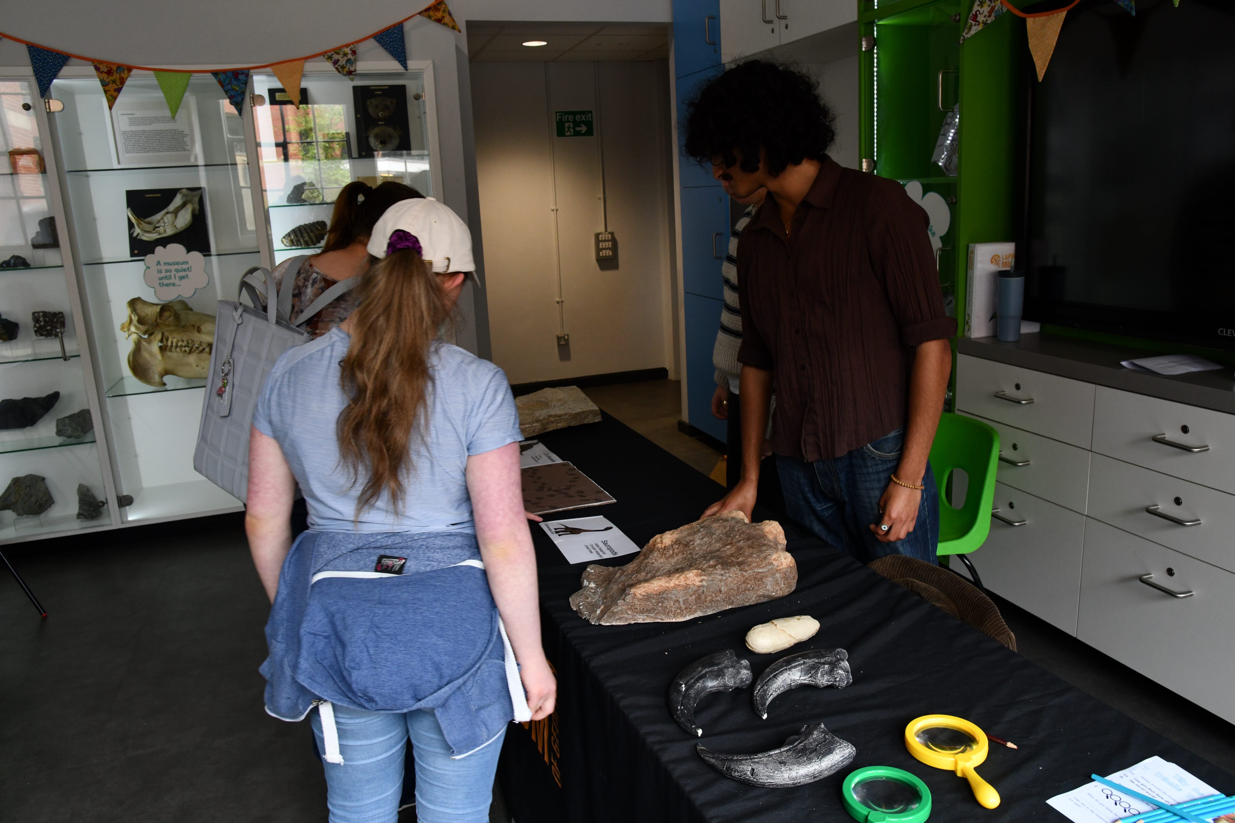 Students engage with the public at a Family Fun Day stall.