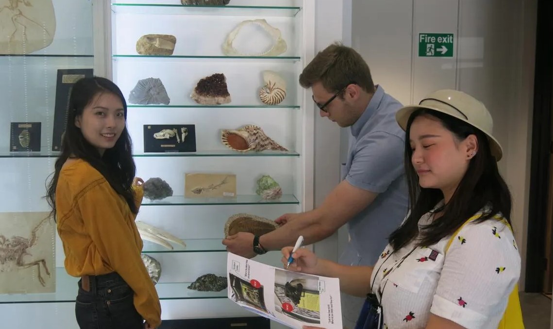 University of Leicester Students Nok, Weike and George in the Museum.