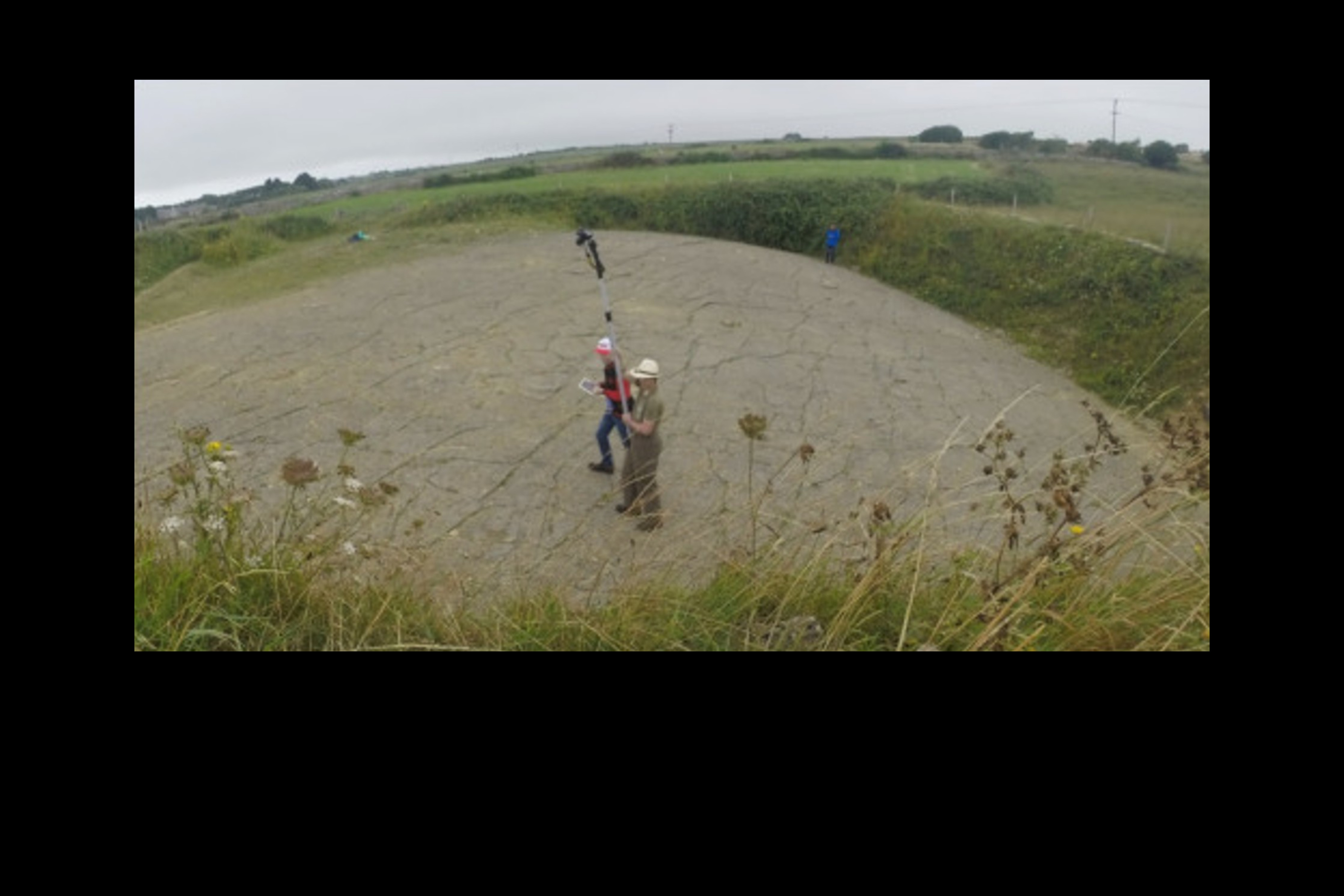 Two people at Spyway Quarry conducting photogrammetry.