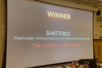 Photo of the screen where the winner of the Learning on Screen award was announced - Shattered, by the University of Birmingham