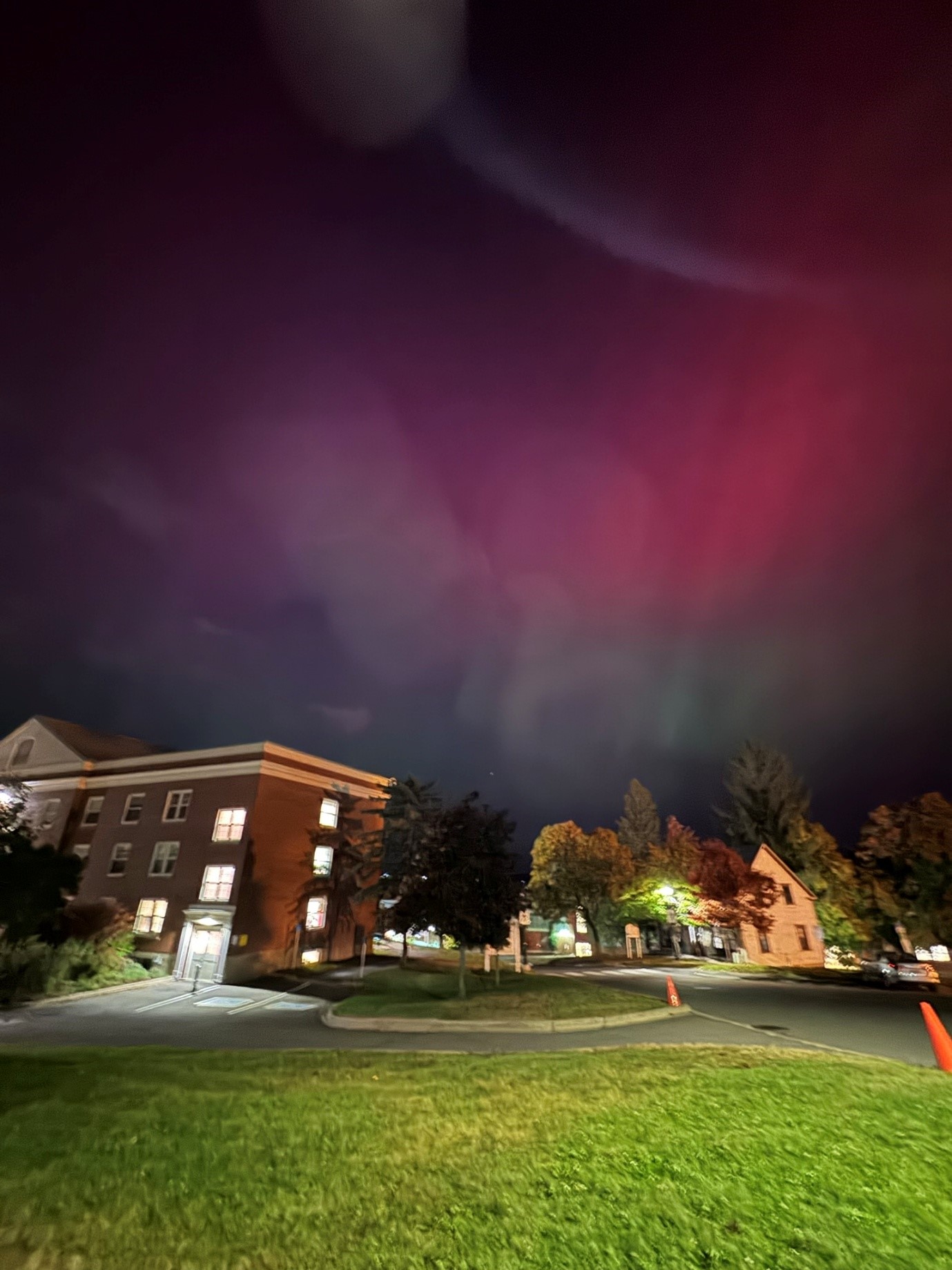 Neighbourhood with northern lights in the sky.