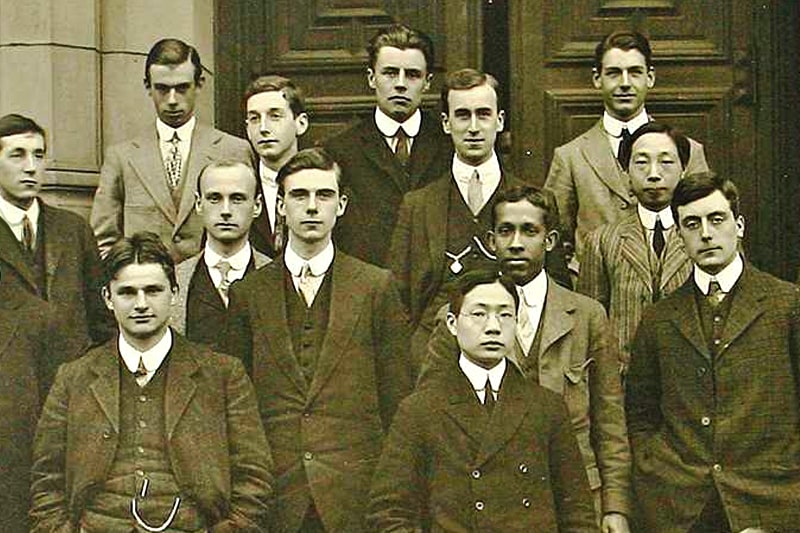 Sepia-coloured photo of members of the University of Birmingham's Mining Department in 1912; a group of white, black and Asian students
