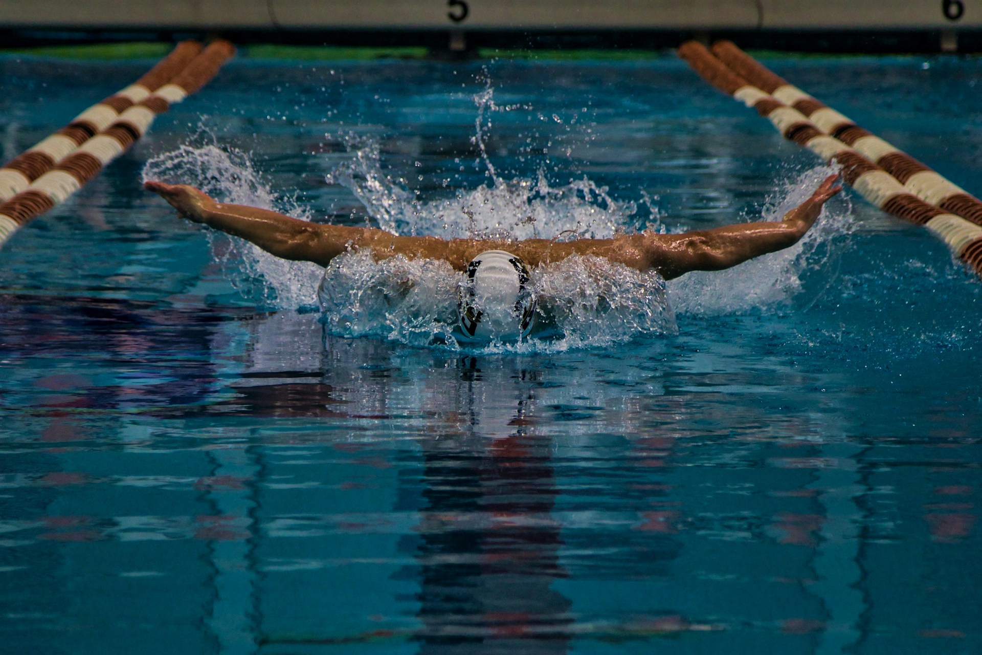 man swimming in a pool 