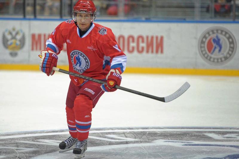 Vladimir Putin in full ice hockey kit playing in a gala tournament in Sochi in 2014.