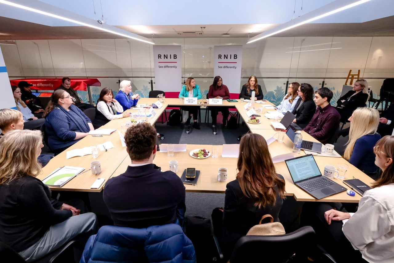 A photo of the attendees sitting around the 'roundtable' together.