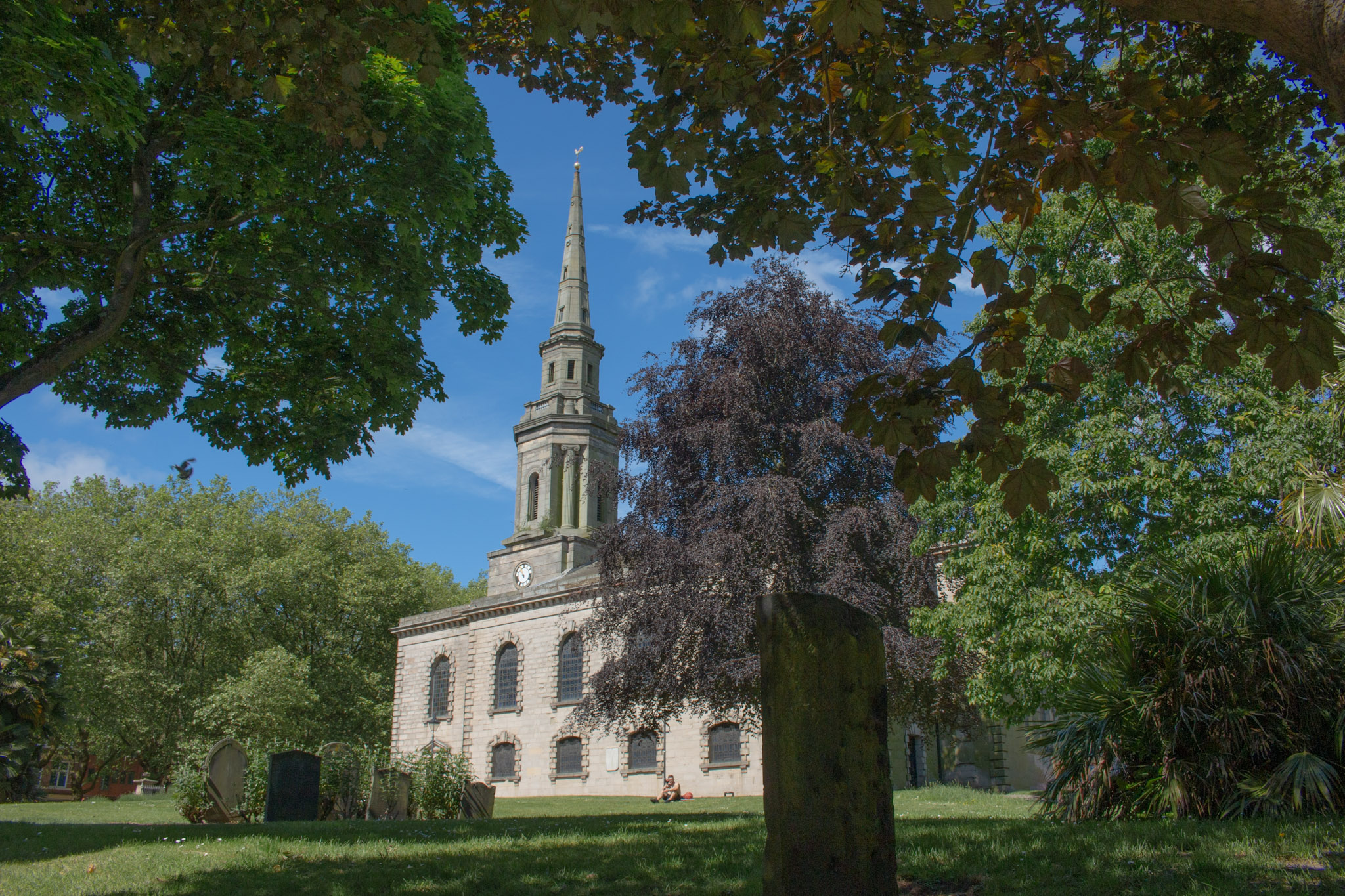 Saint Pauls church surrounded by lots of trees and grass 
