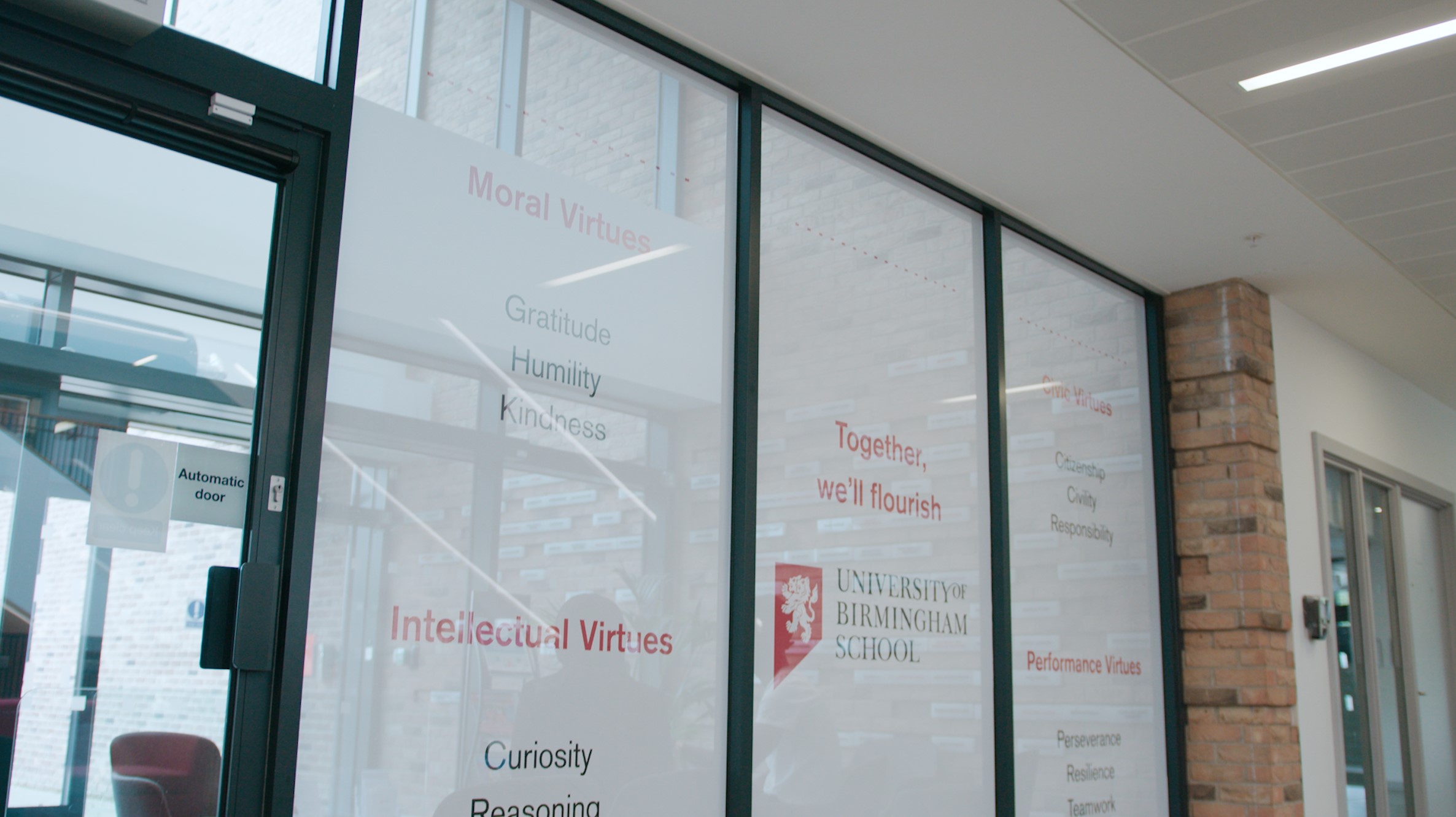 University of Birmingham School's window display of the four types of virtues: Moral, Intellectual, Civic, Performance 