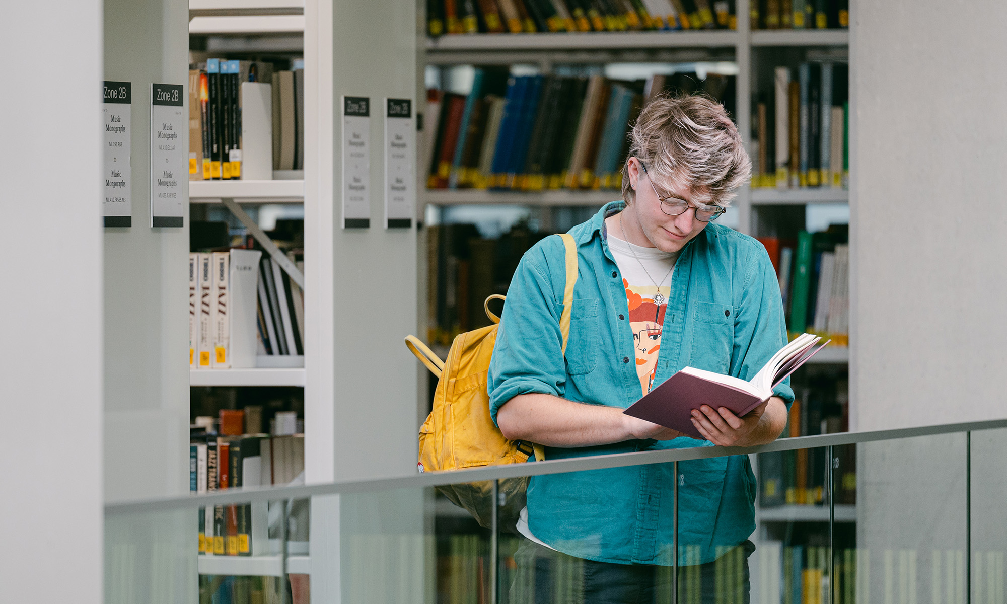 a student reading in the University of Birmingham library
