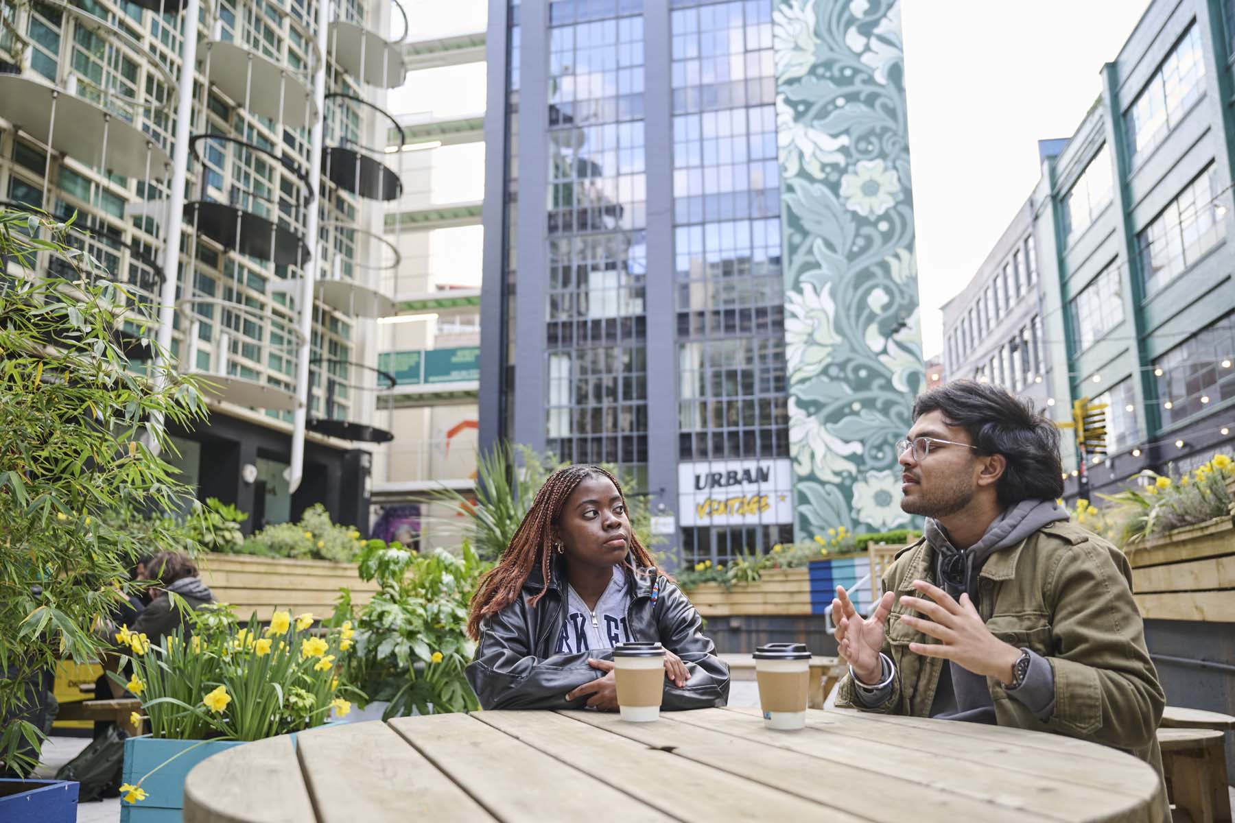 2 students sat having coffee
