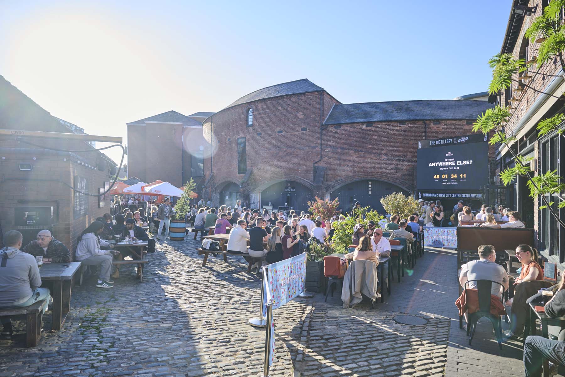 Beer garden in front of old red brick building