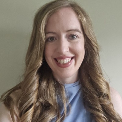 Laura Quinn, wearing a blue shirt.