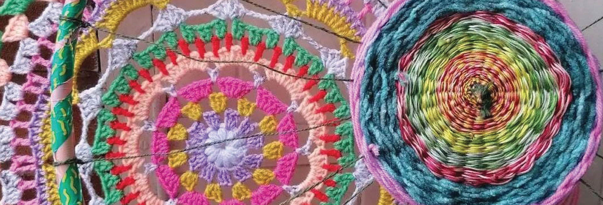 Multi-coloured yarn hand-woven into circle patterns.