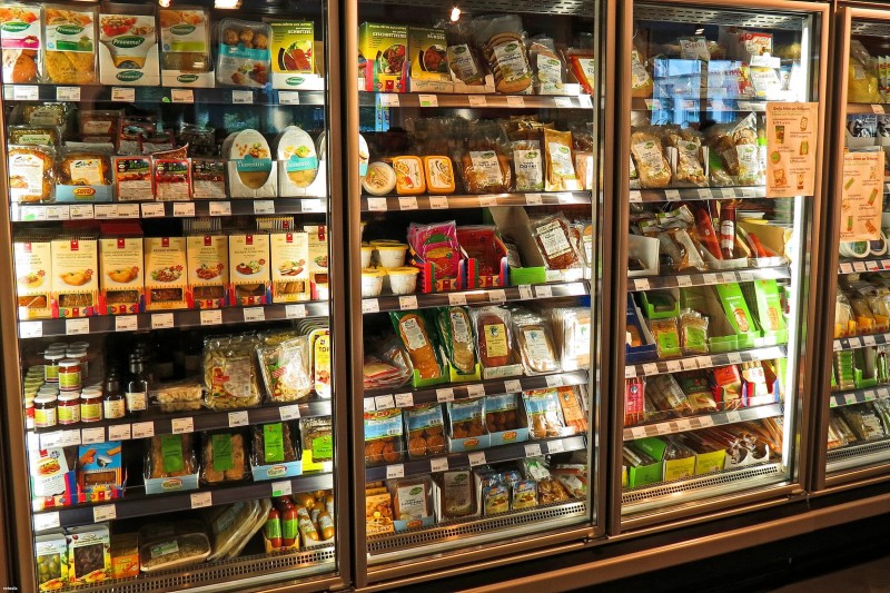 Refrigerator filled with food in a supermarket
