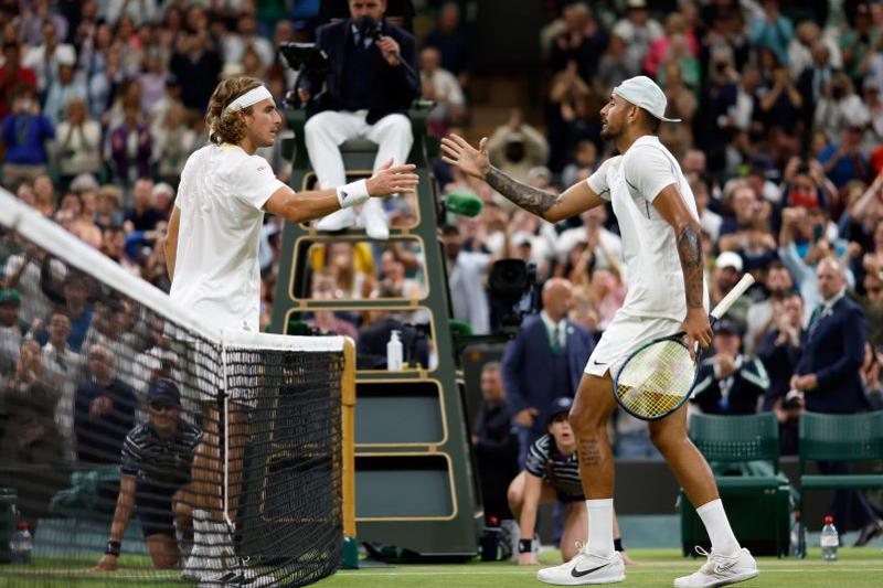 Nick Kyrgios and Stefanos Tsitsipas greet each other post-match