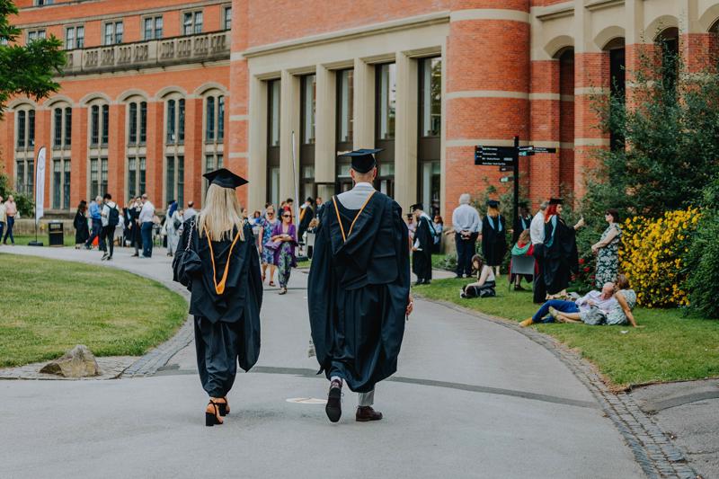 Two graduants walking towards the Great Hall for their graduation ceremony
