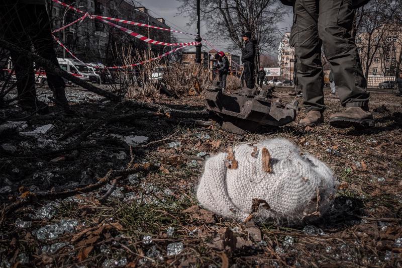 A woolly hat lies on the floor among debris near a cordoned off area following shelling by Russian forces