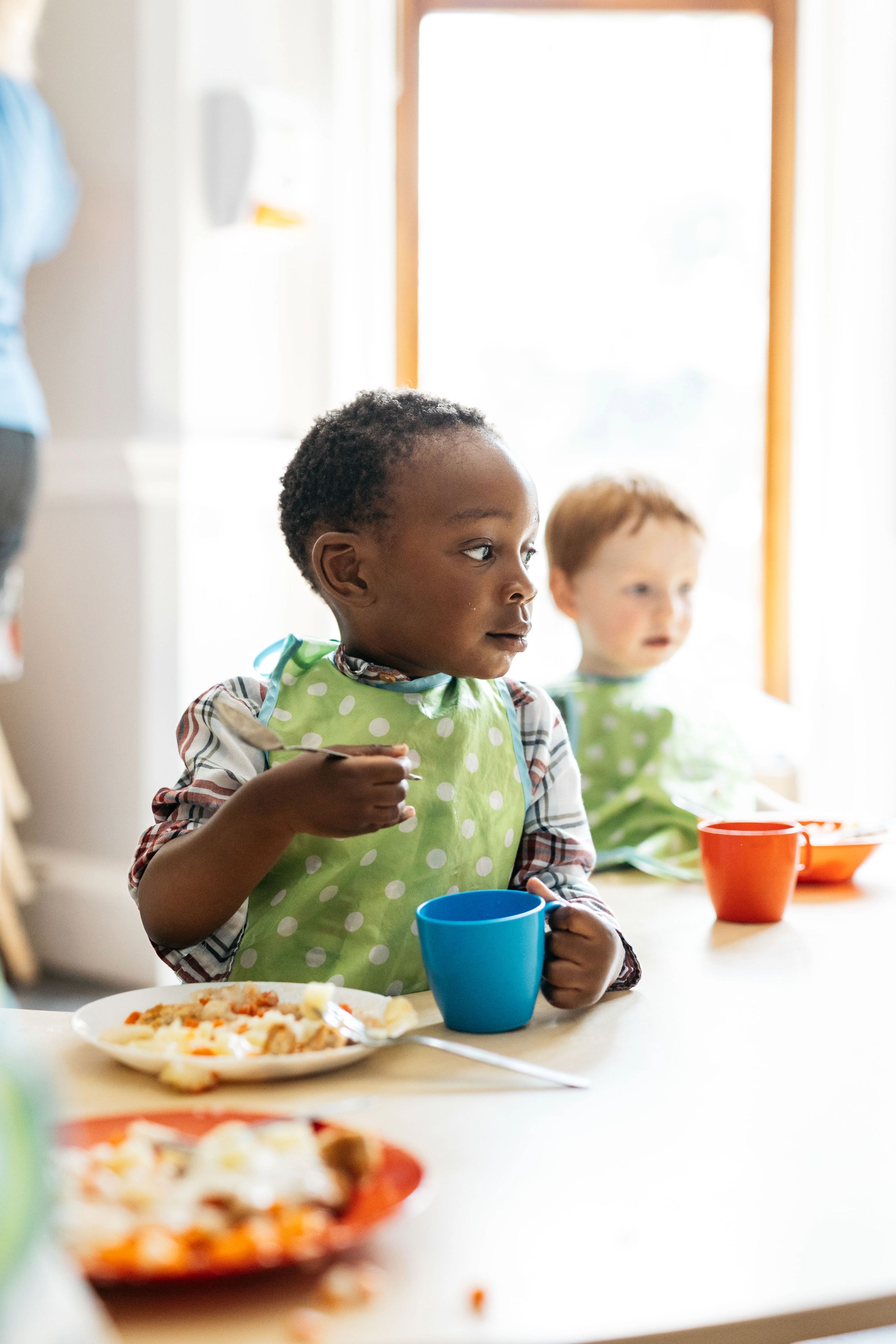 A child drinking at lunchtime