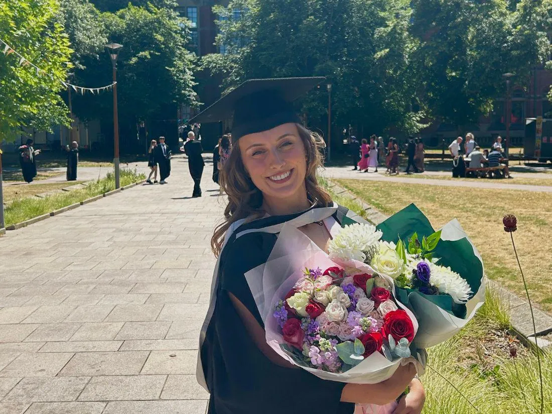 Victoria on her graduation day on campus