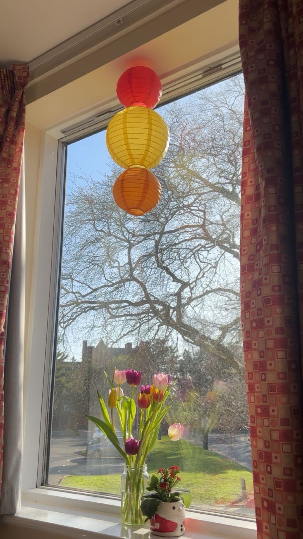 A vase of flowers on a windowsill