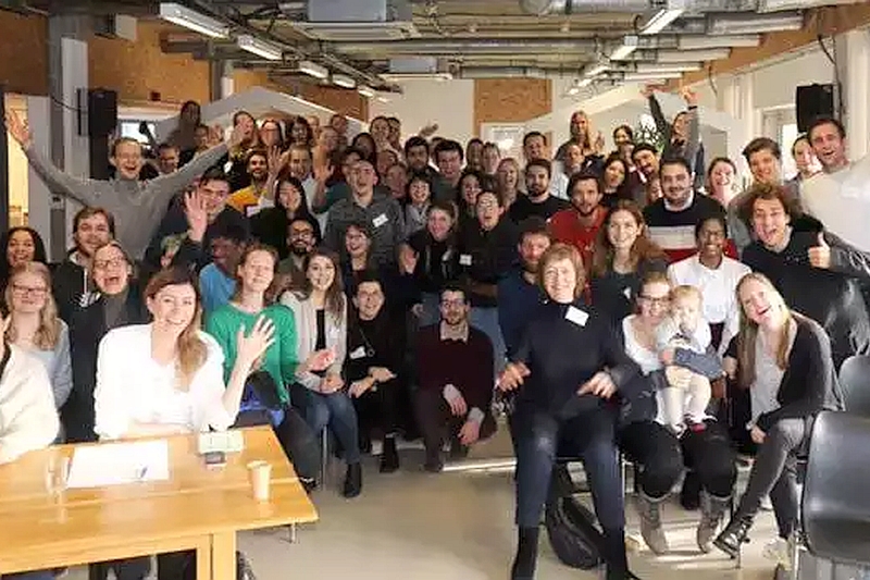 EUniWell students gather in group and smile for camera