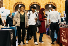 students browsing stands at a careers fair